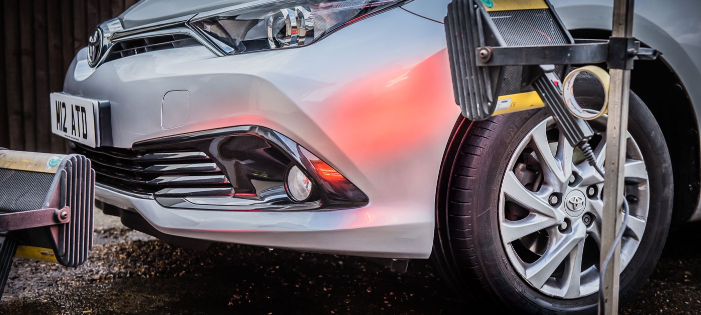 Toyota Auris front bumper under infrared lamps after Attention to Detail mobile smart bumper repairs image by Ian Skelton Photography