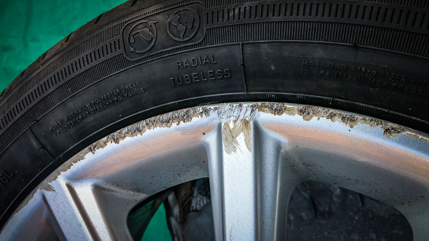 Ford Focus alloy wheel damage before repair by Attention to Detail mobile smart repairs alloy wheels image by Ian Skelton Photography